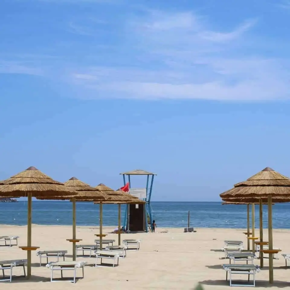 Beach umbrellas facing sea at Lido Azzurro Catania